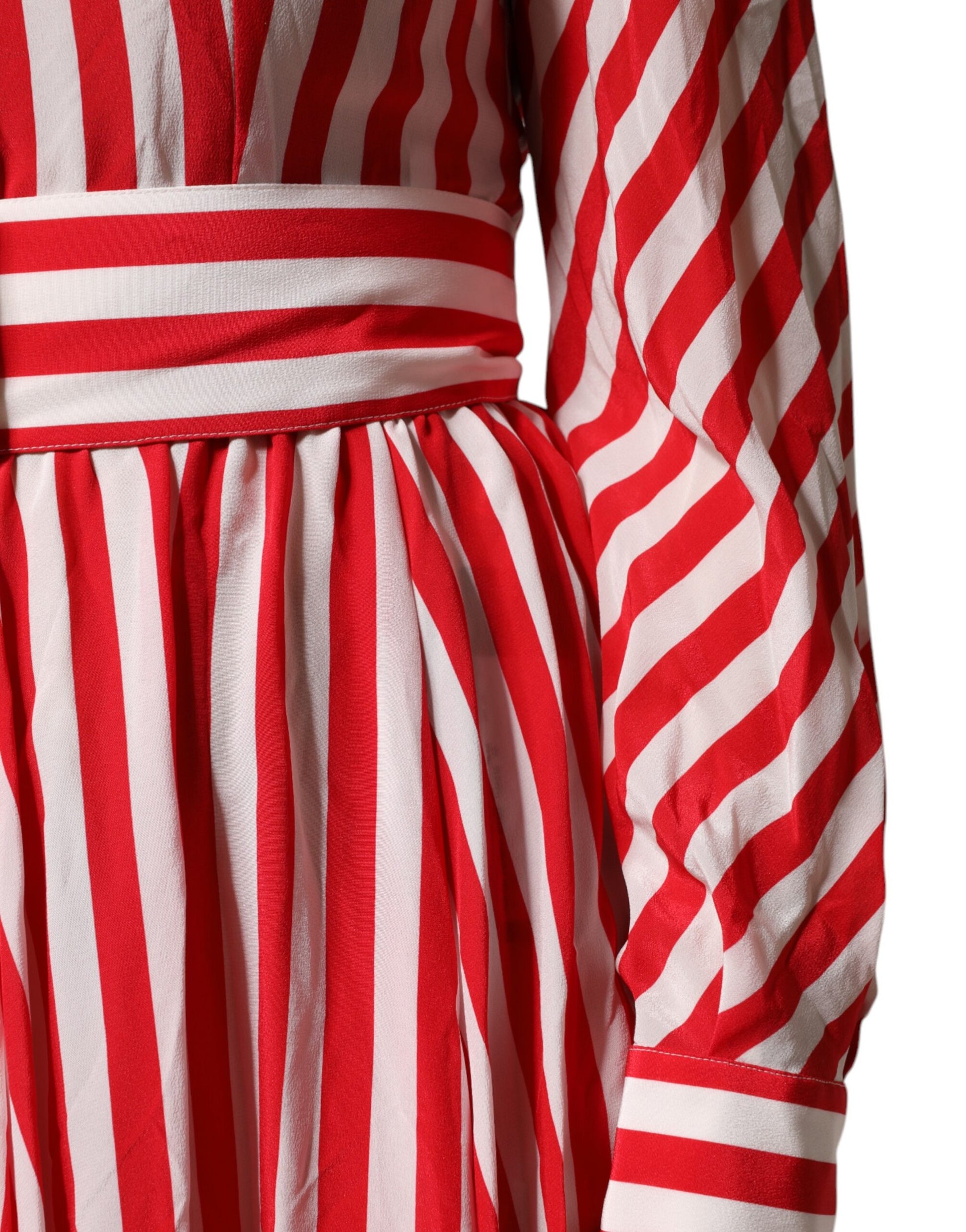 A red and white striped midi dress with long sleeves