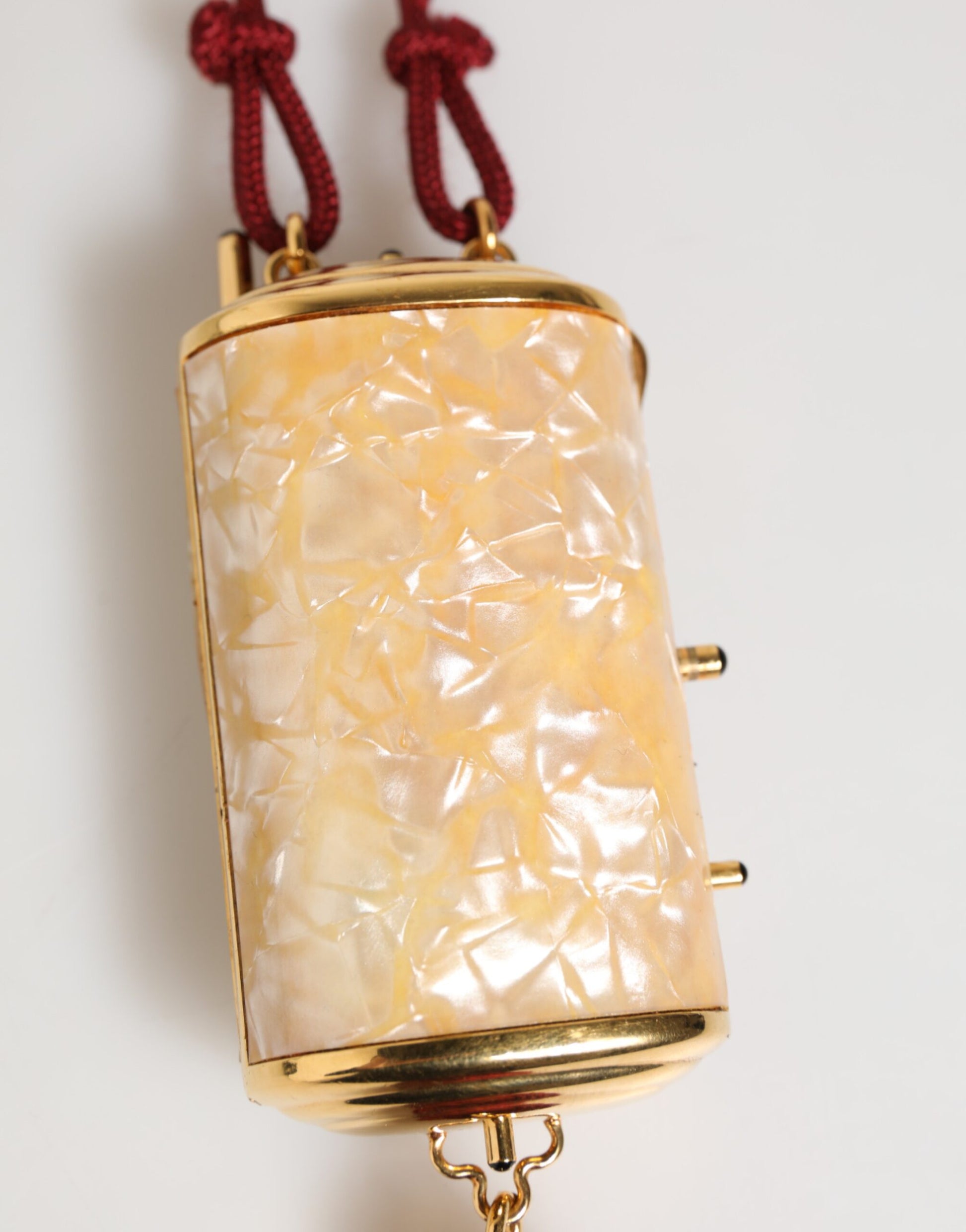 Gold necklace pendant with yellow opaque stone