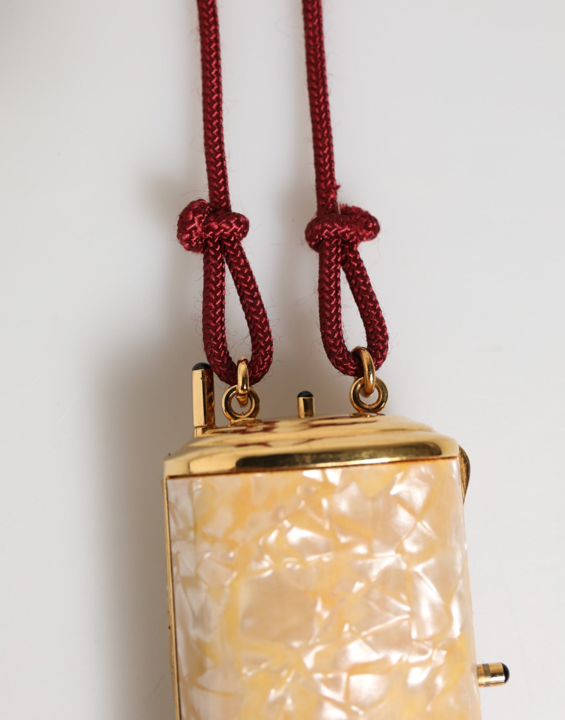 Gold pendant with pearlized glass beads