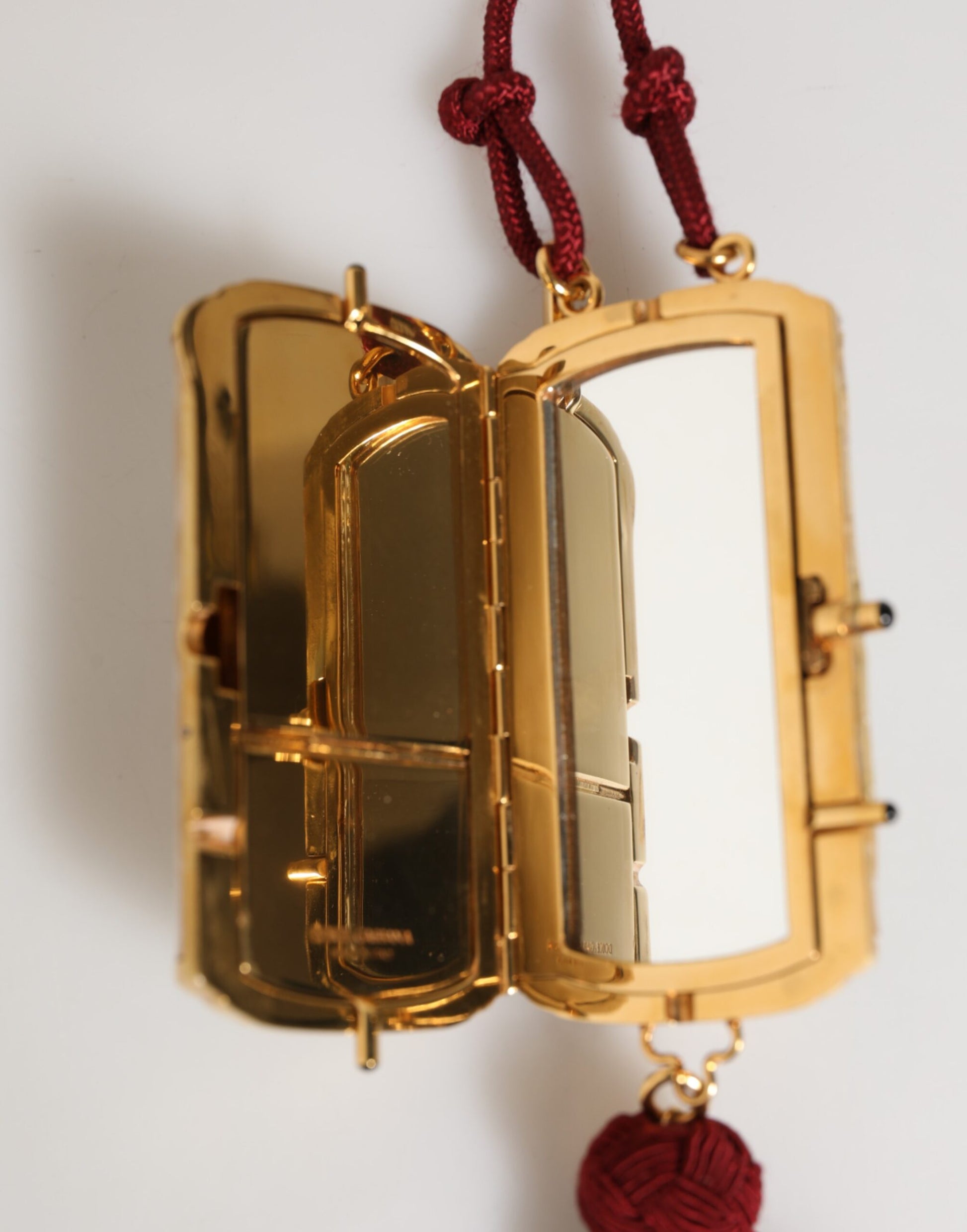 Gold locket necklace with mirror inside