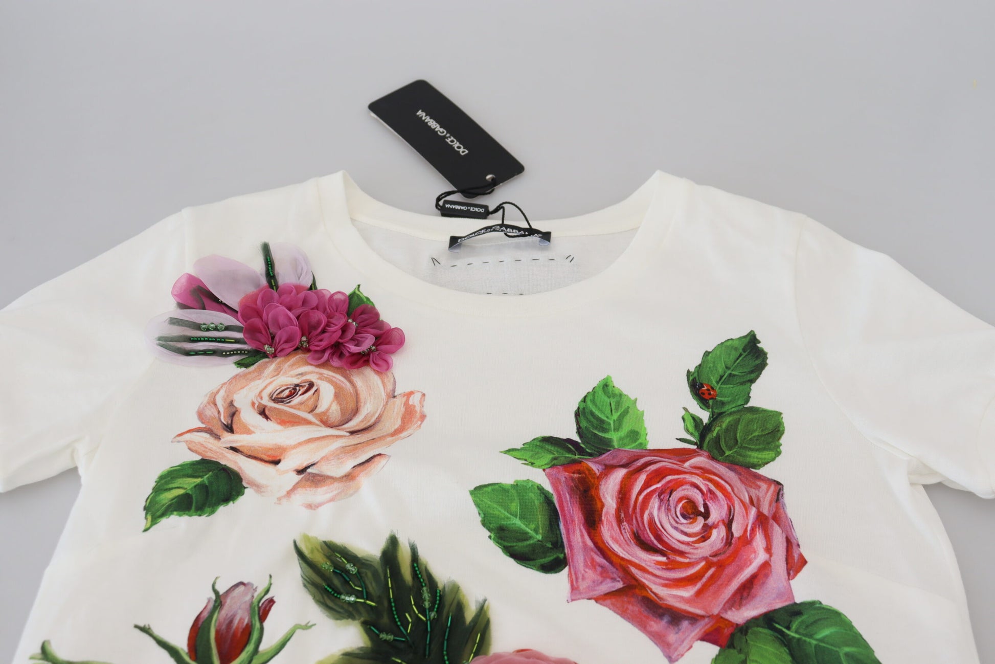 White floral print top on hanger