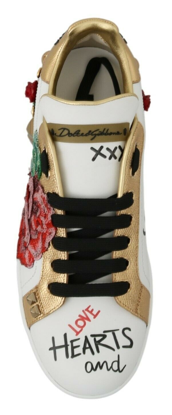 Gold and white sneaker with heart design on side