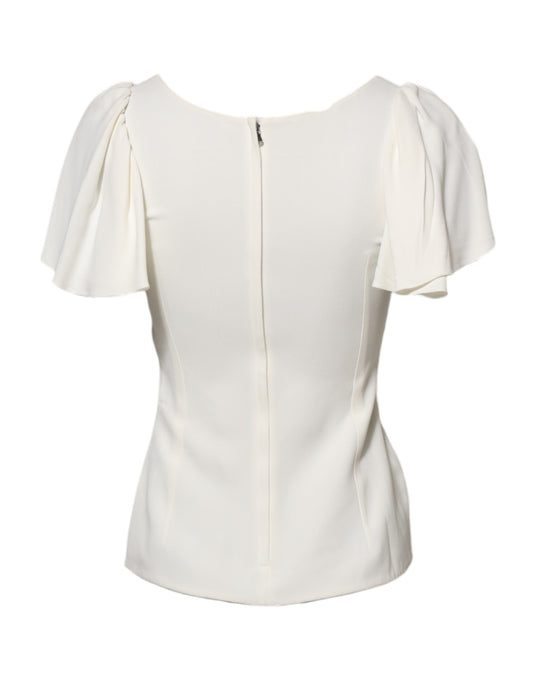 White sleeveless blouse with ruffled shoulders