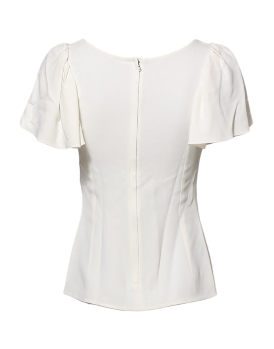 White sleeveless top with ruffled shoulders