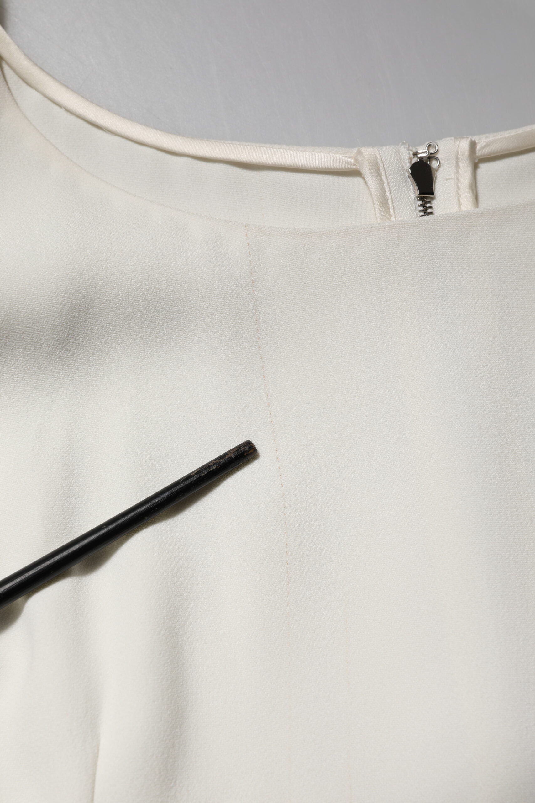 White sweater on hanger