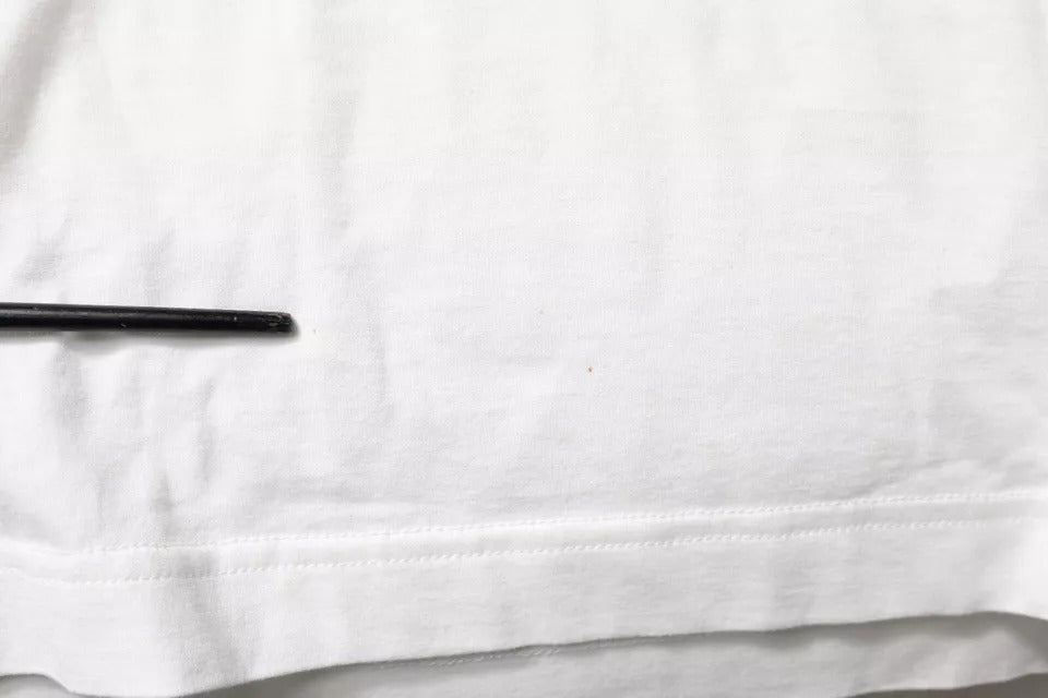 White cloth with black pen on top