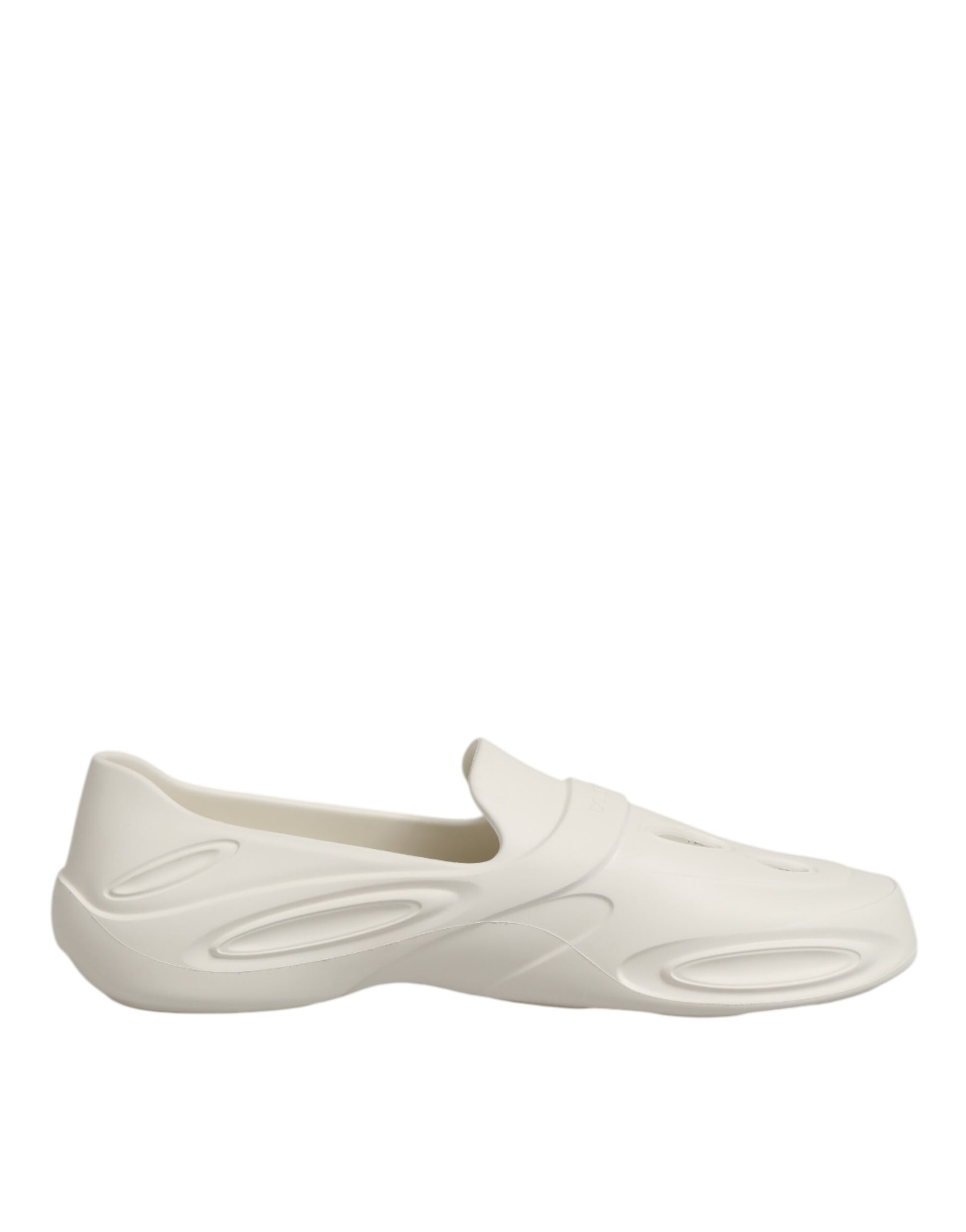 White slipper shoe with ridges on bottom for grip