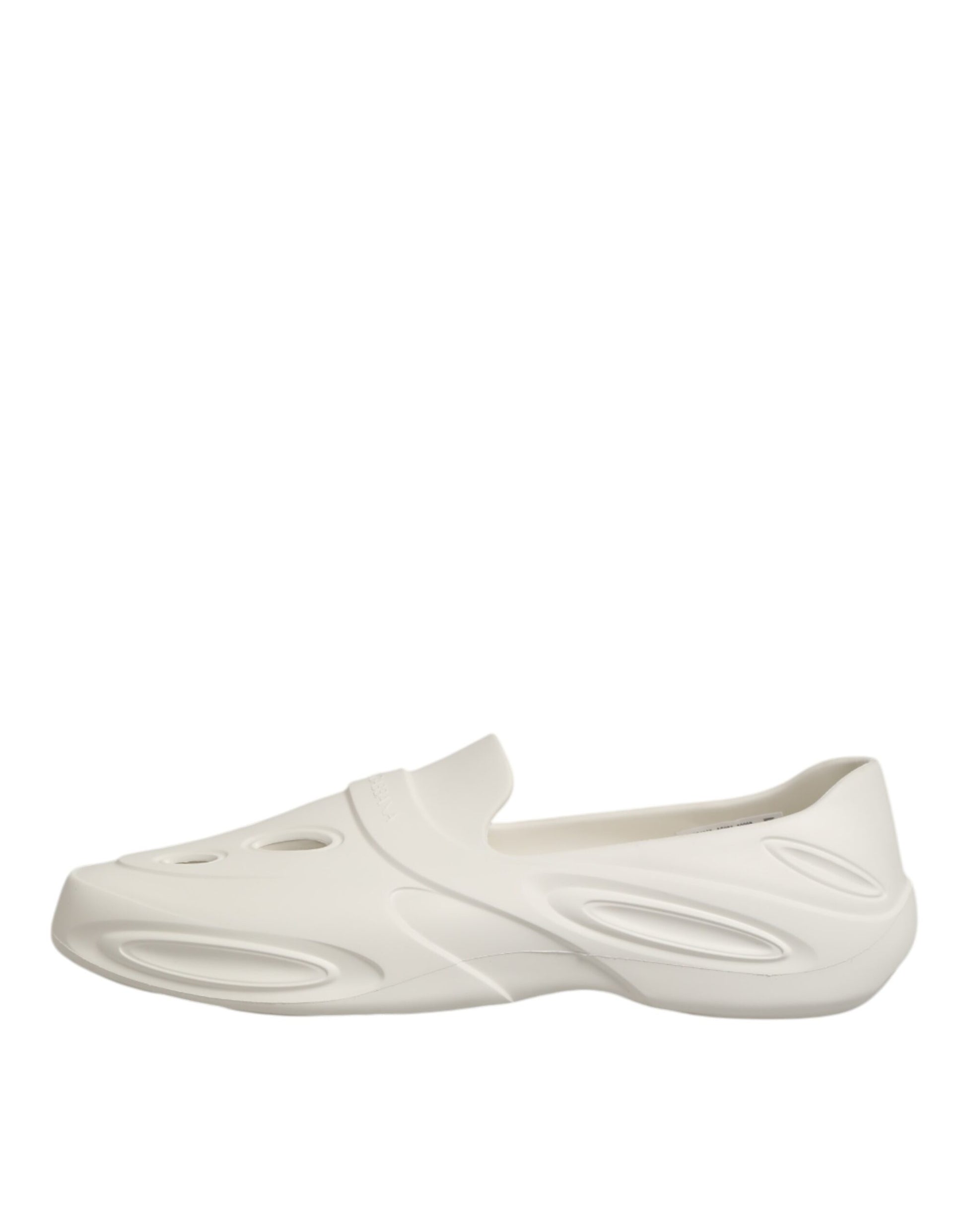 White slip on shoes with a textured sole