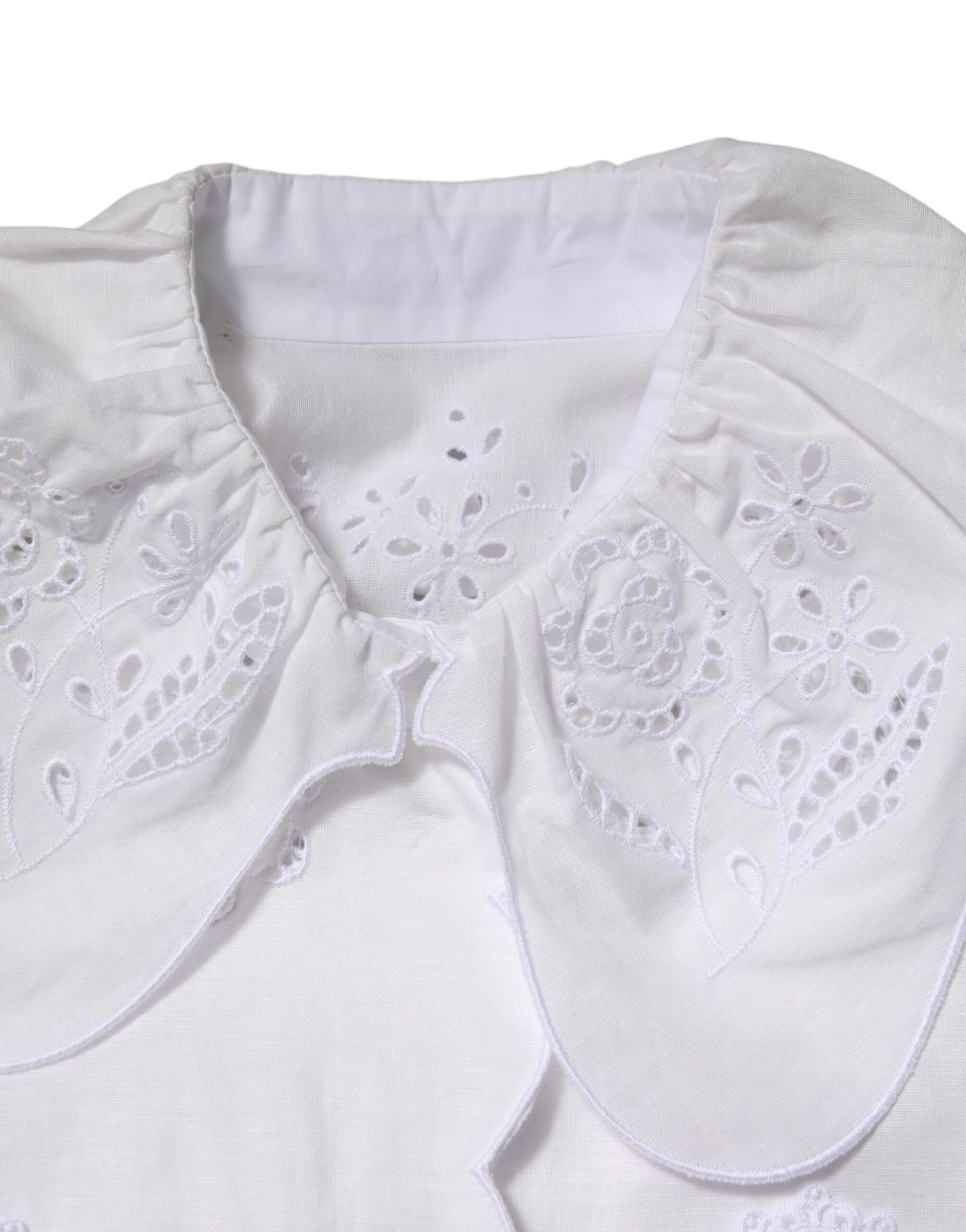 White lace garment with embroidered detailing