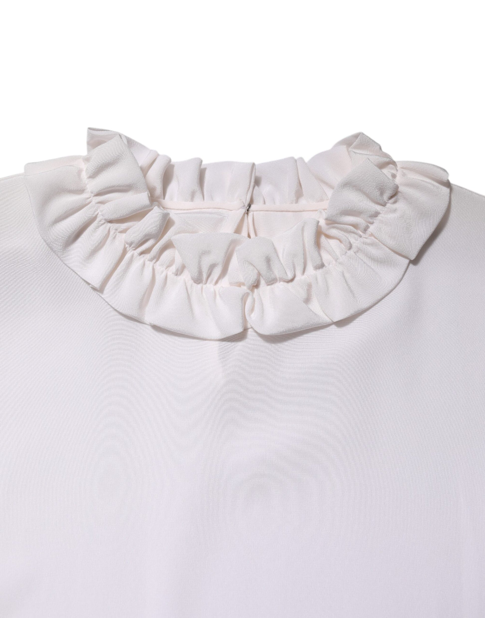 Pink ruffled collar on a white shirt