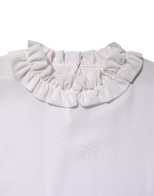 Pink ruffled collar on a white shirt