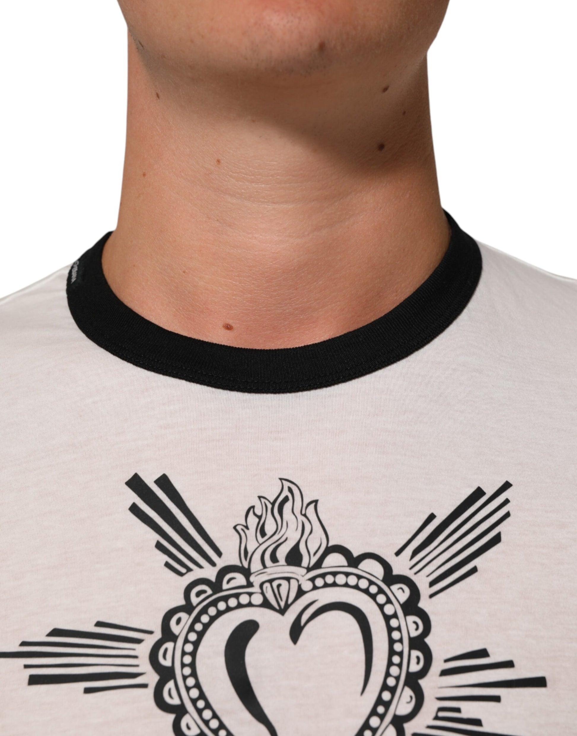 Man wearing white t-shirt with black design on front