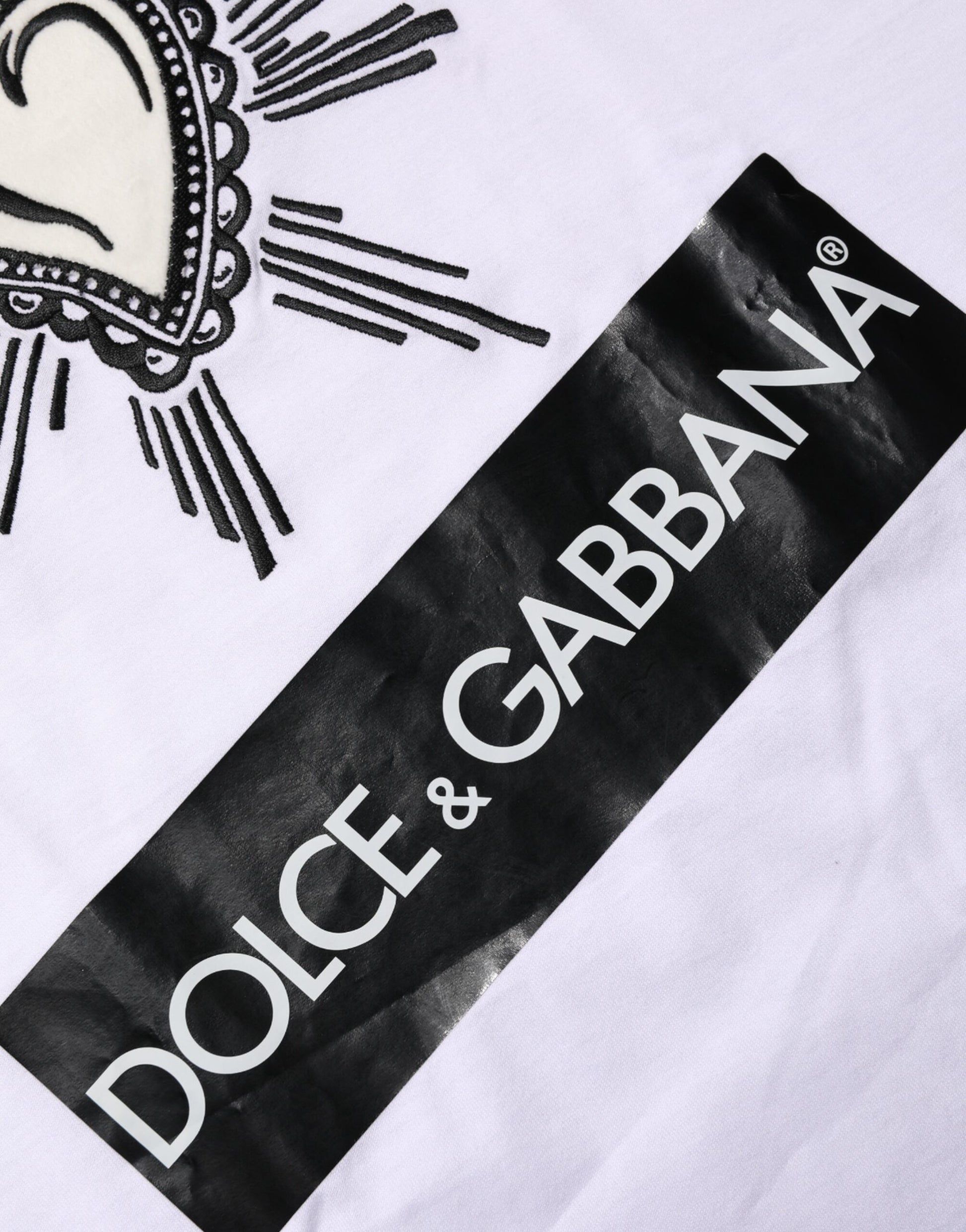 White t-shirt with black and white logos for Dolce & Gabbana and D&G