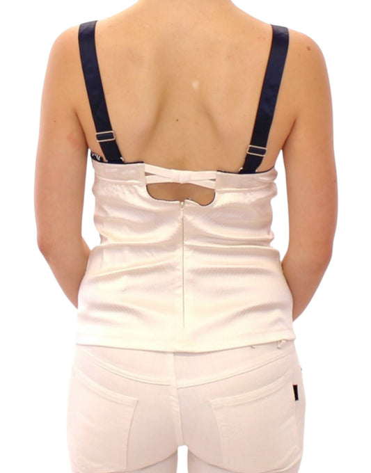 Woman wearing white pants and a backless top