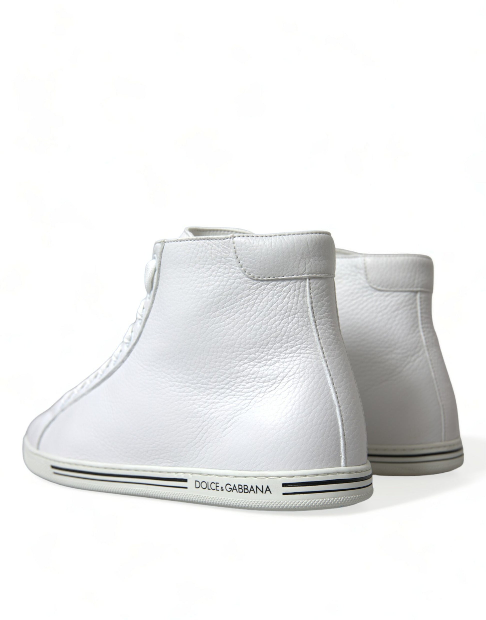 Pair of white leather baby boots with black laces and soles