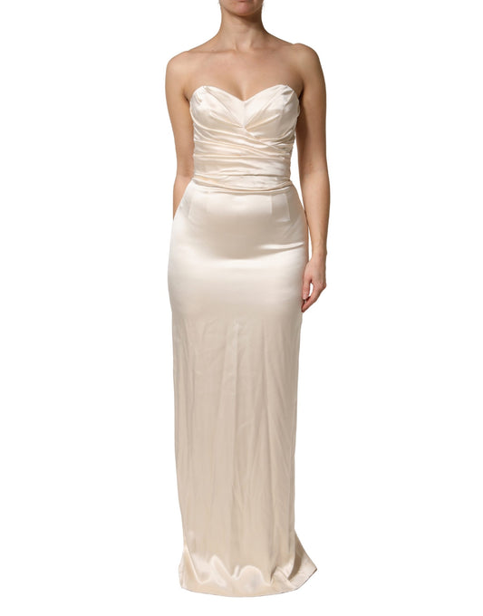 A white satin strapless sheath maxi dress by Dolce & Gabbana
