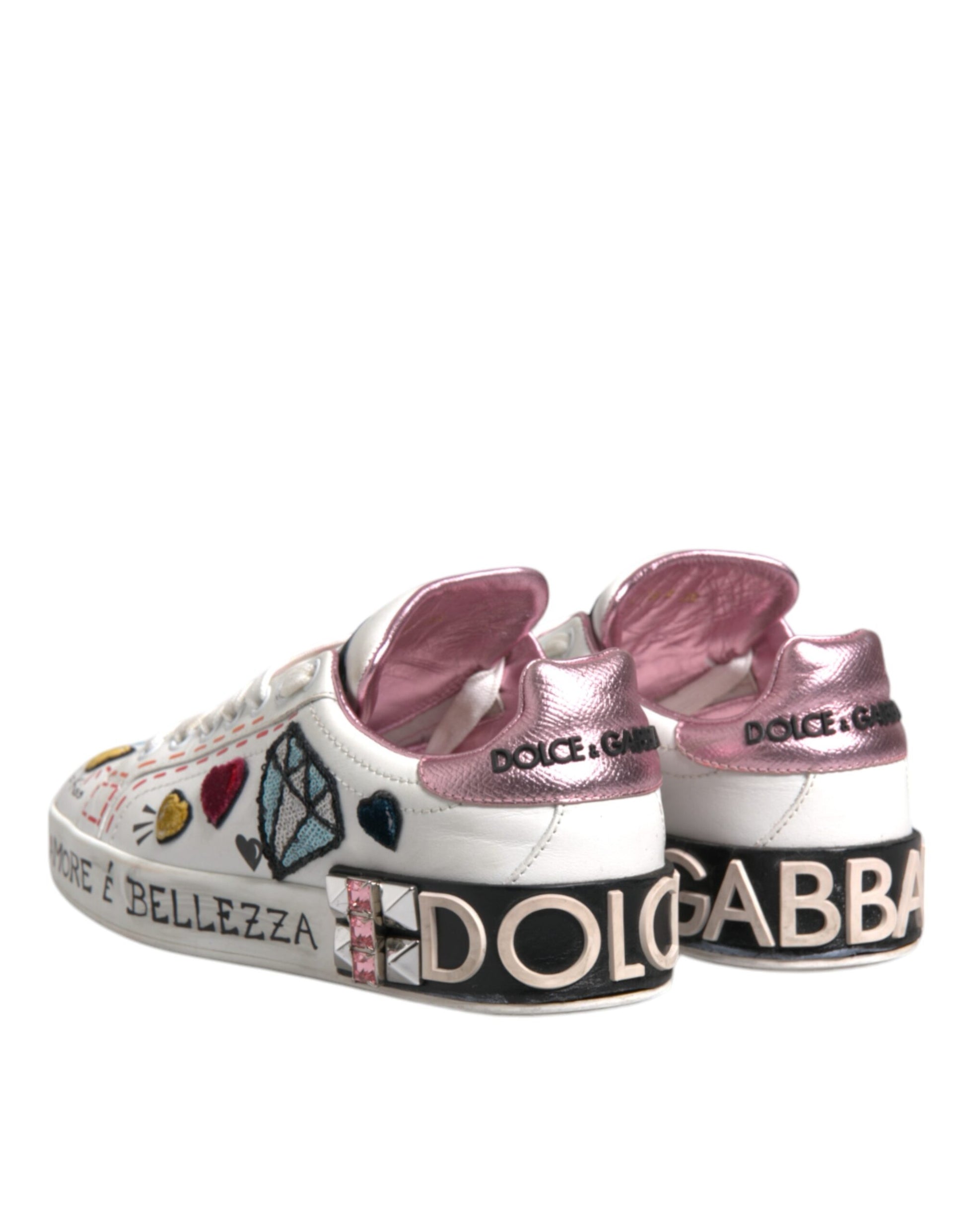Pink sneakers with glittery designs and brand names