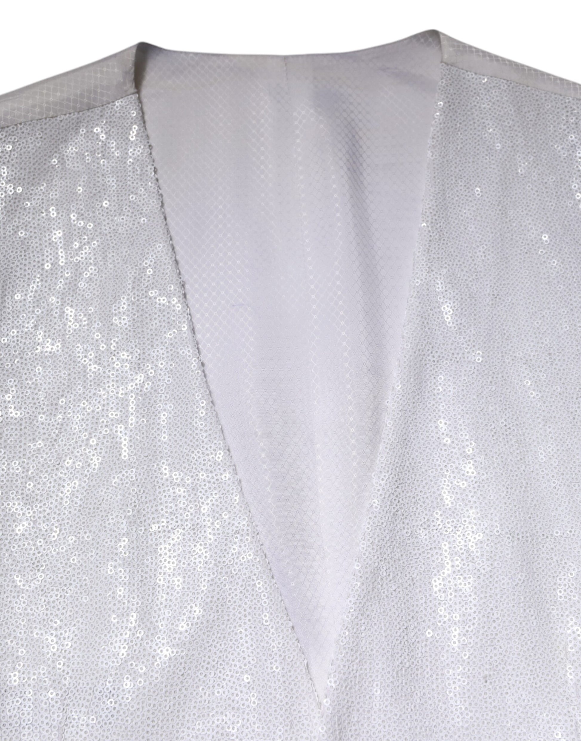 A white sequined vest with a formal waistcoat design