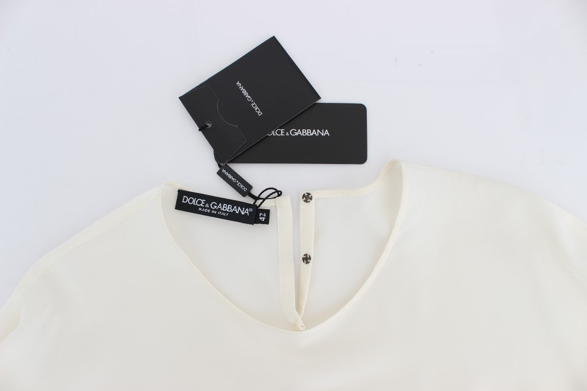 Yellow shirt on hanger with tags attached to collar