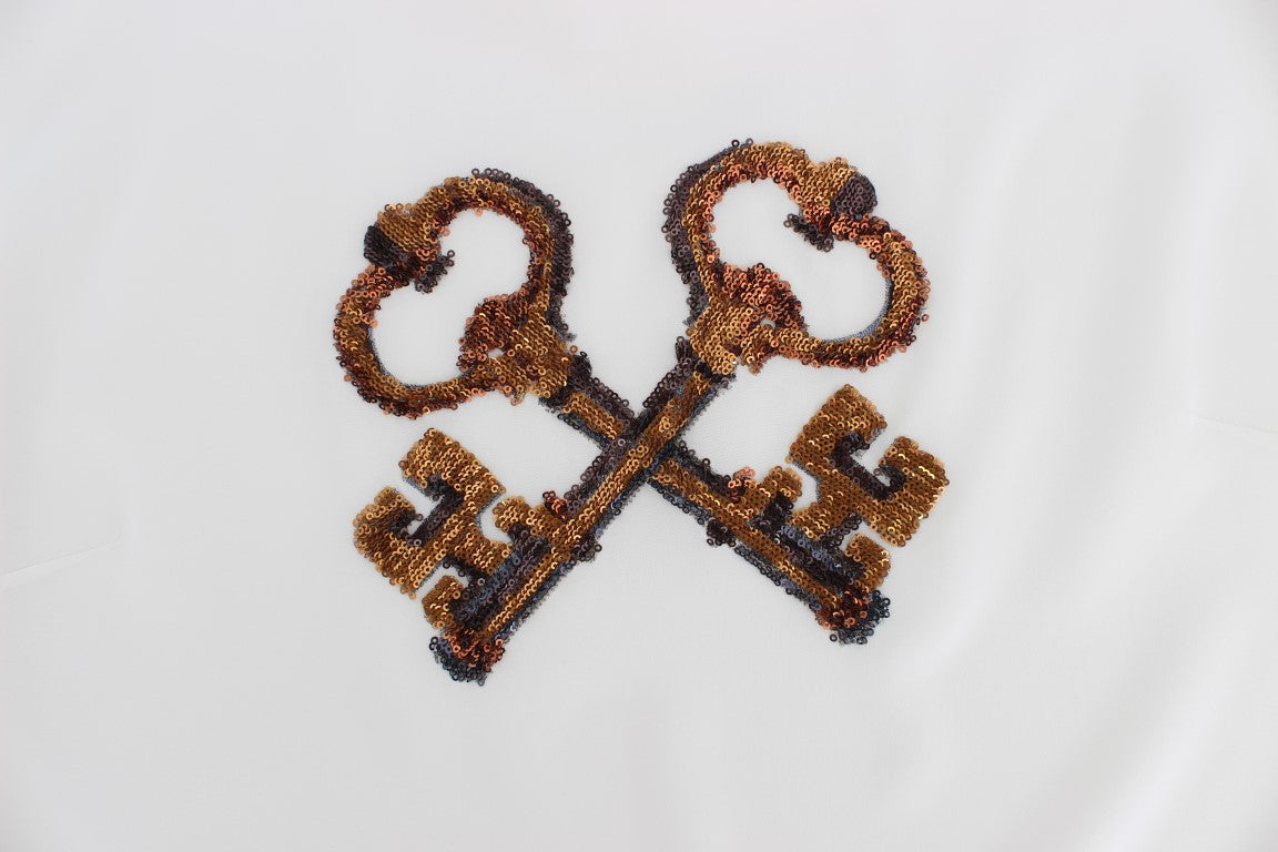 Embroidered key design on fabric