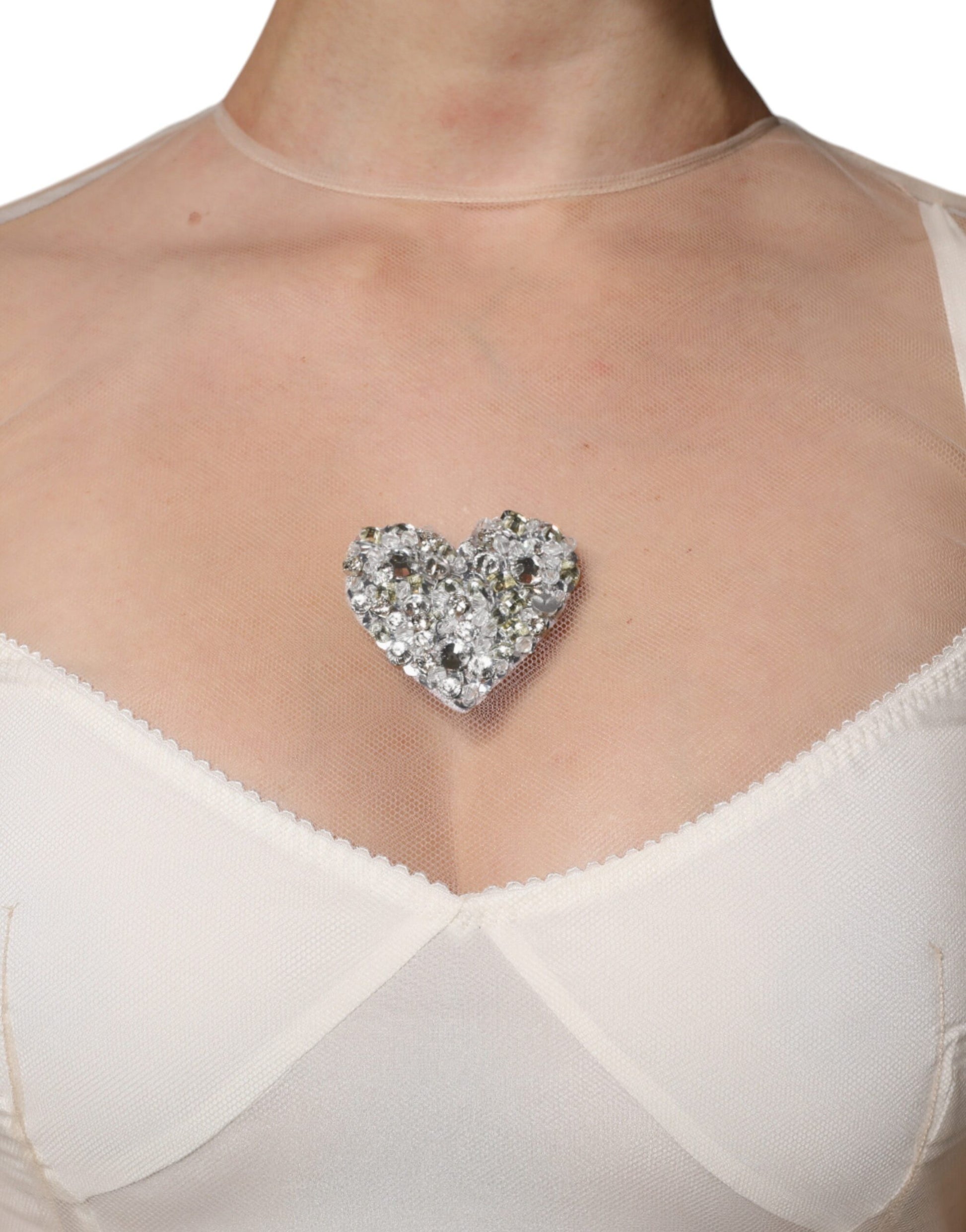 Heart-shaped diamond necklace on white sheer tulle bustier