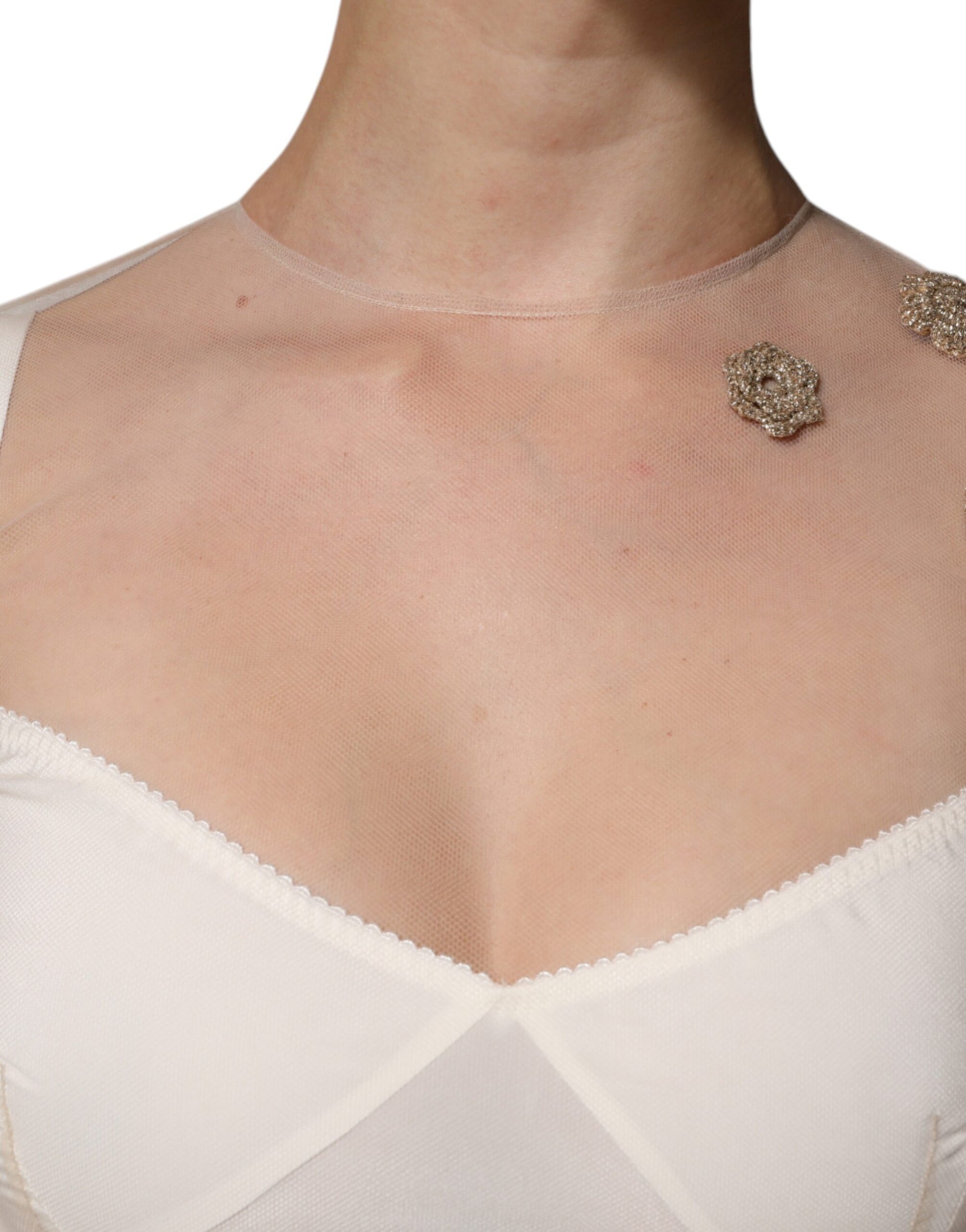 A white sheer tulle bustier bodycon midi dress with a necklace