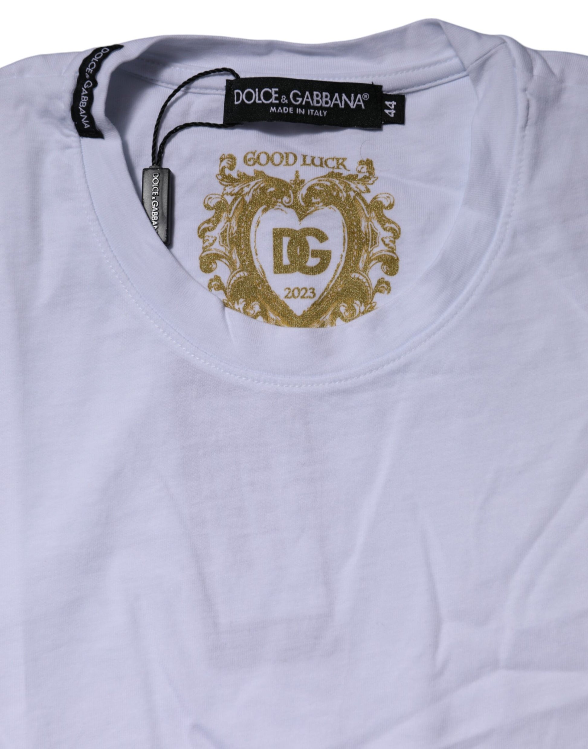 White t-shirt with gold lettering and logo