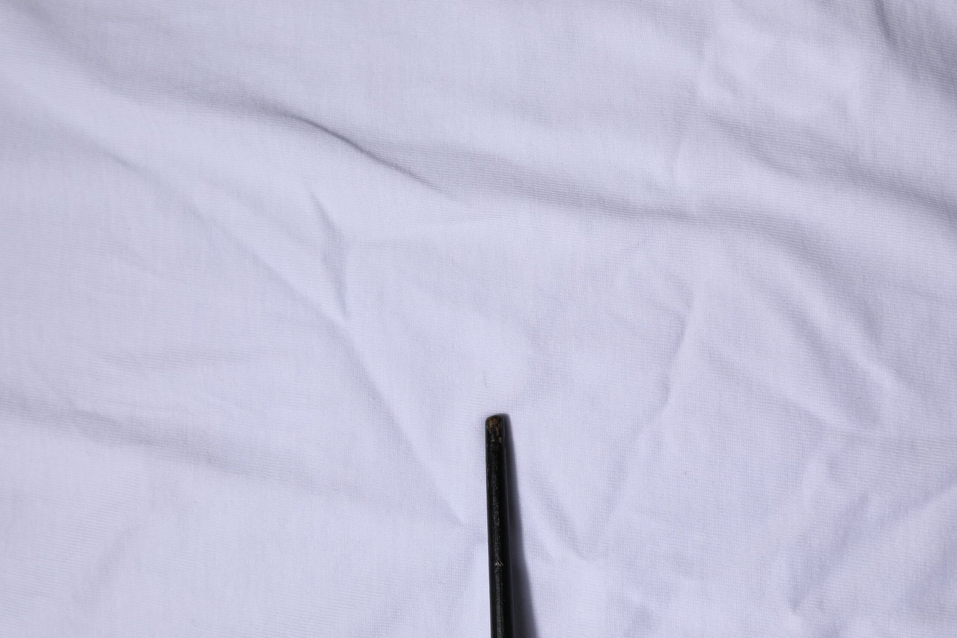 Black pen on white cloth