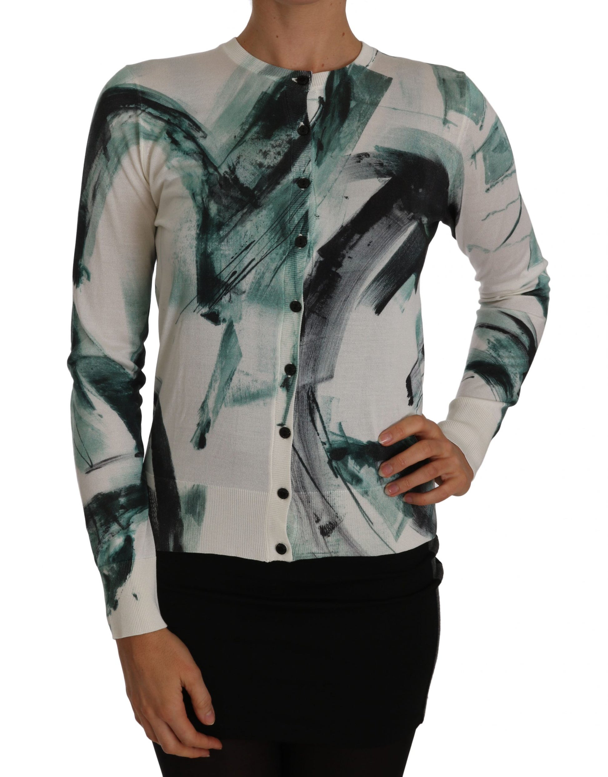 Woman wearing a sweater with abstract design on front