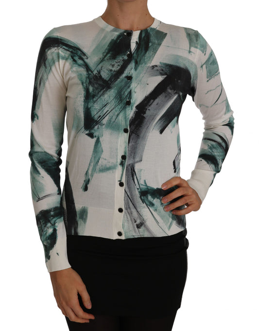 Woman wearing a sweater with abstract design on front