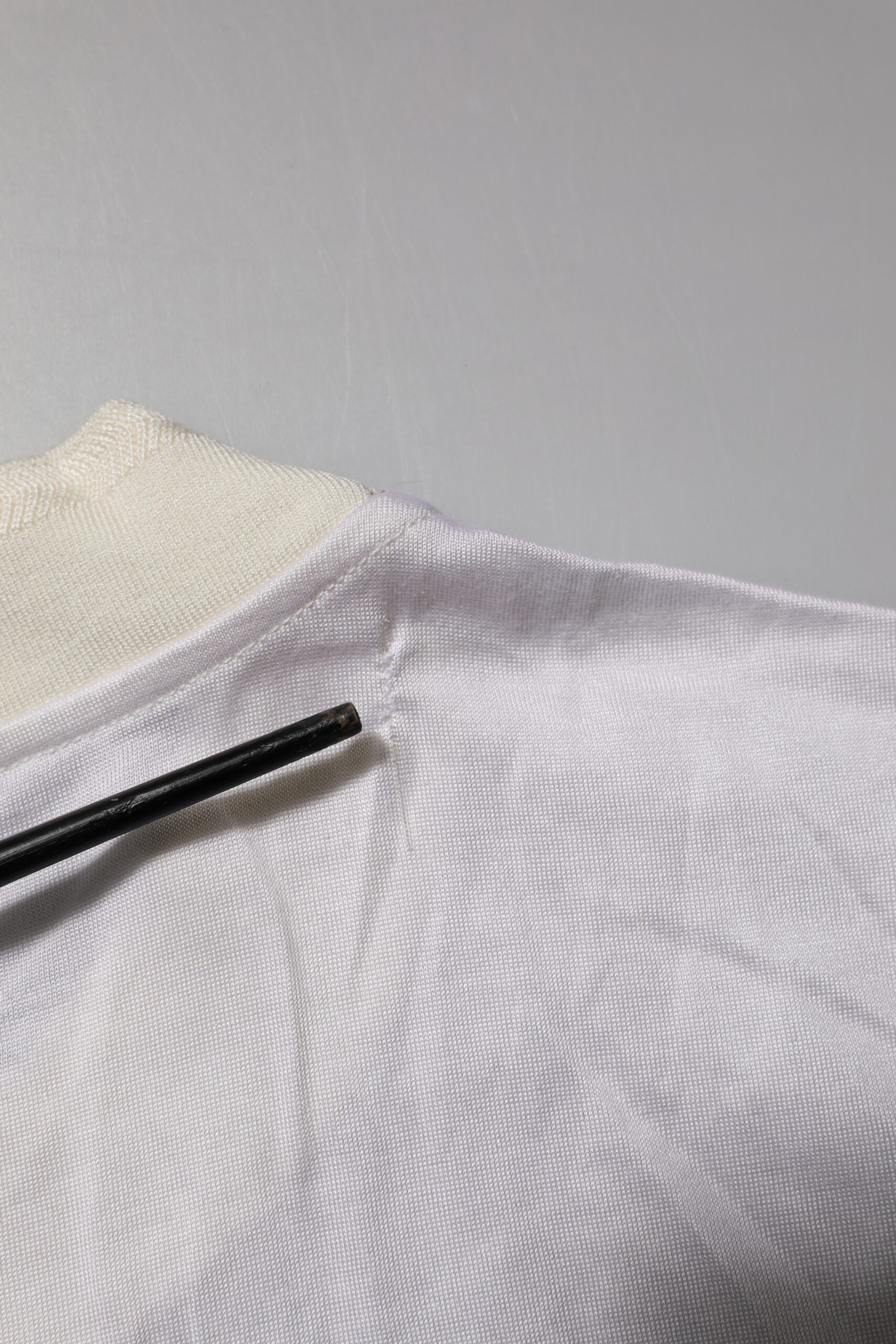 White fabric with black zipper