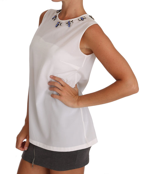 White sleeveless top with embellishments on shoulders