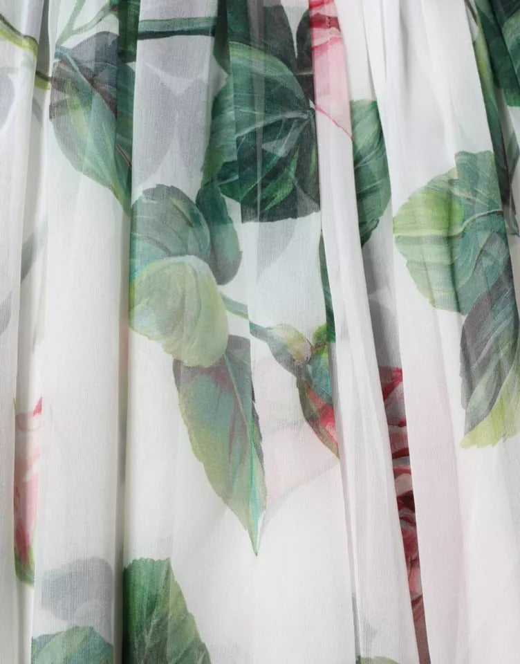 A white silk midi dress with floral print, featuring a leafy pattern