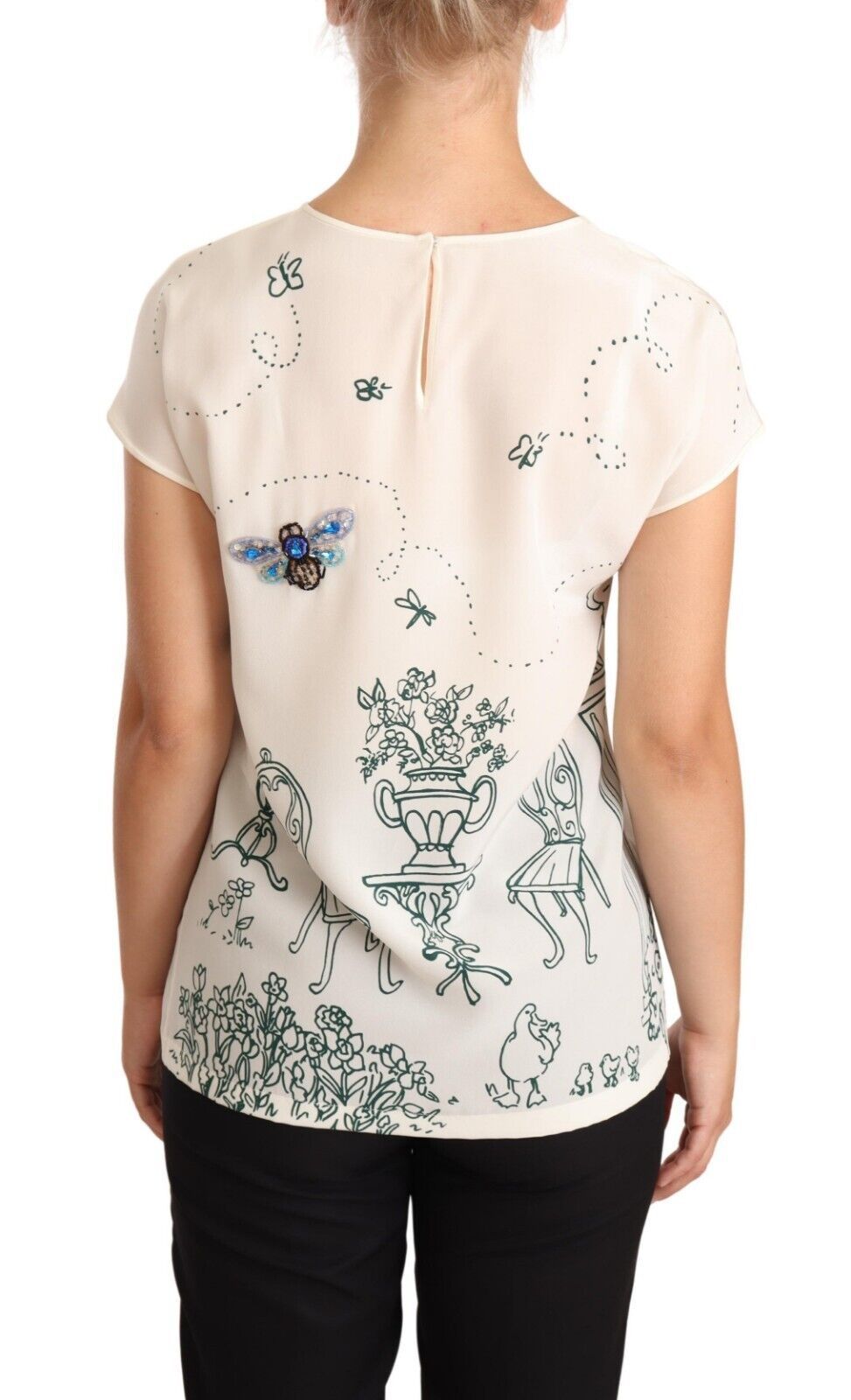 Back view of a woman's shirt with floral pattern and blue accents