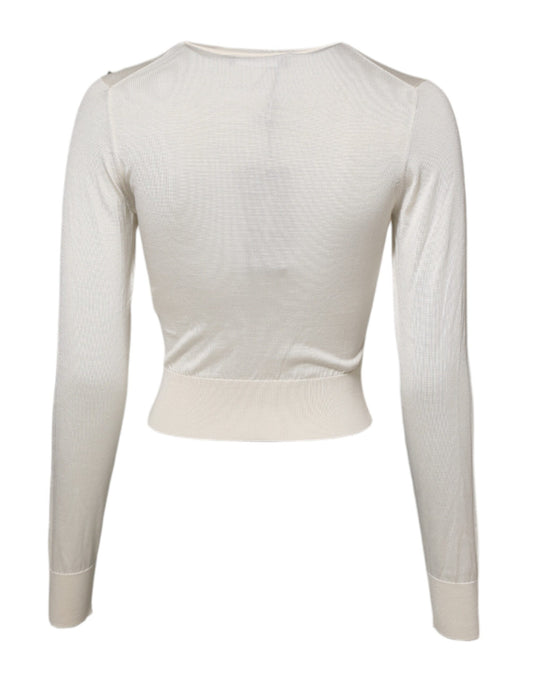 Long sleeve top with high neckline and fitted waistband