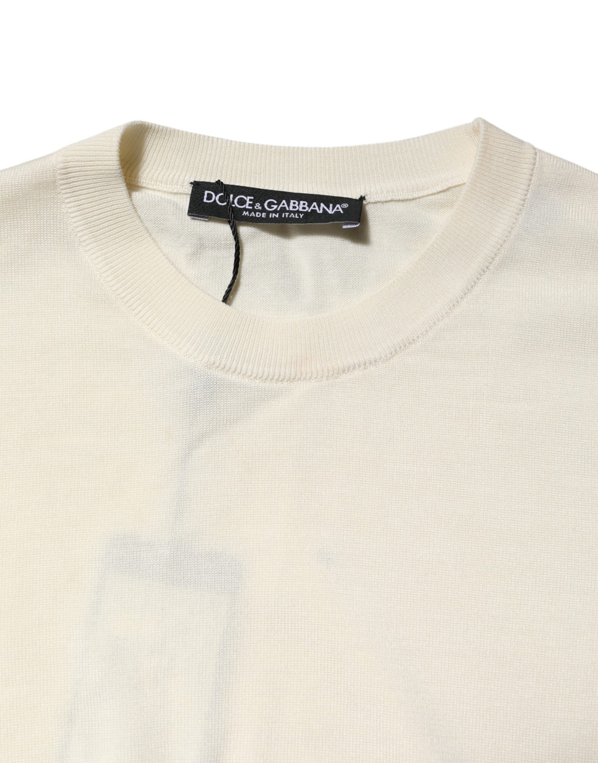 Tan sweater on hanger