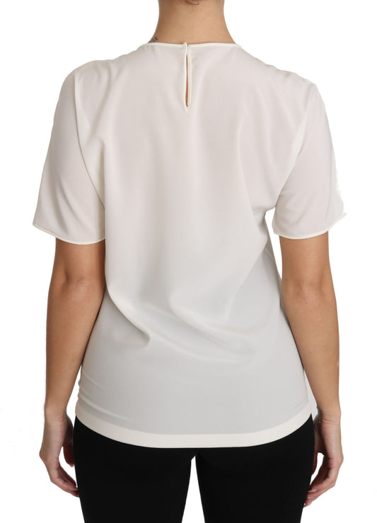 White blouse with short sleeves and a V neckline