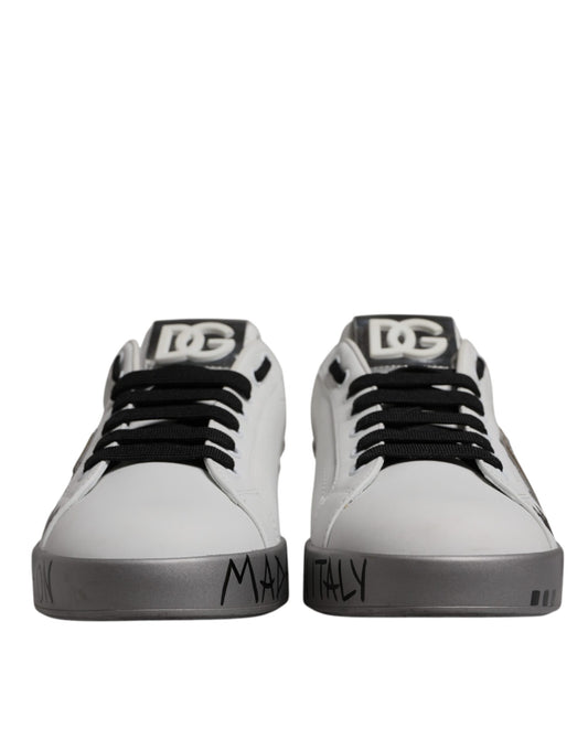 Pair of white sneakers with black laces and soles