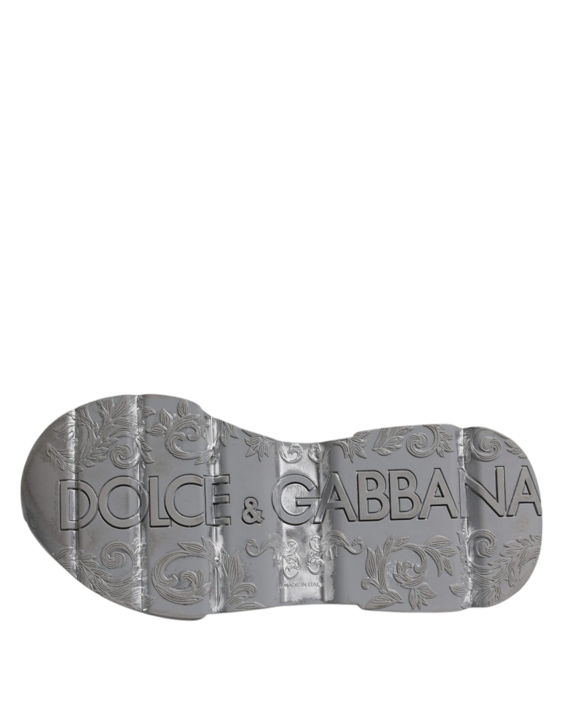 A pair of white silver D&G sneakers with a low top design
