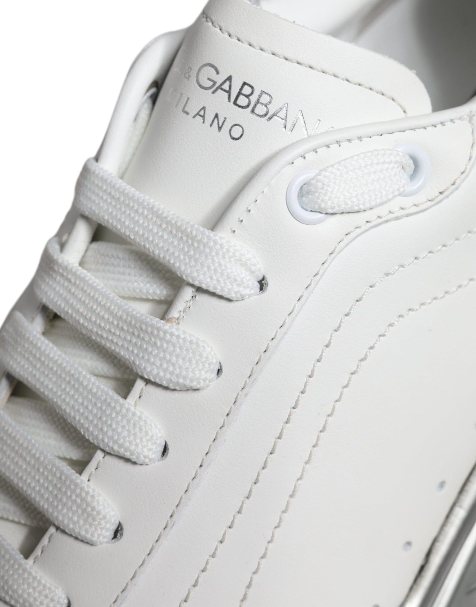 White sneaker with brand name on side