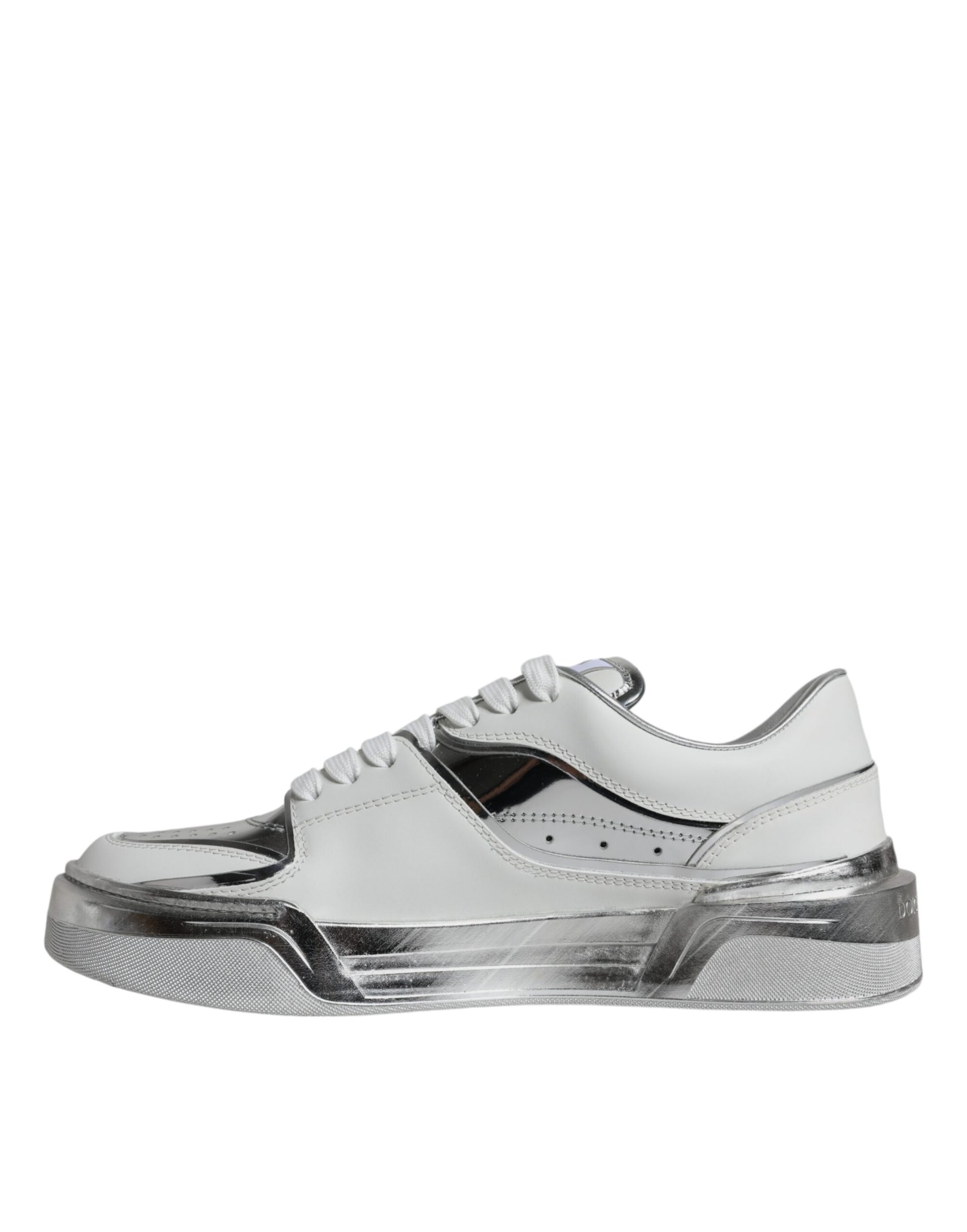 A pair of white silver leather low top sneakers with a lace-up front and a textured sole