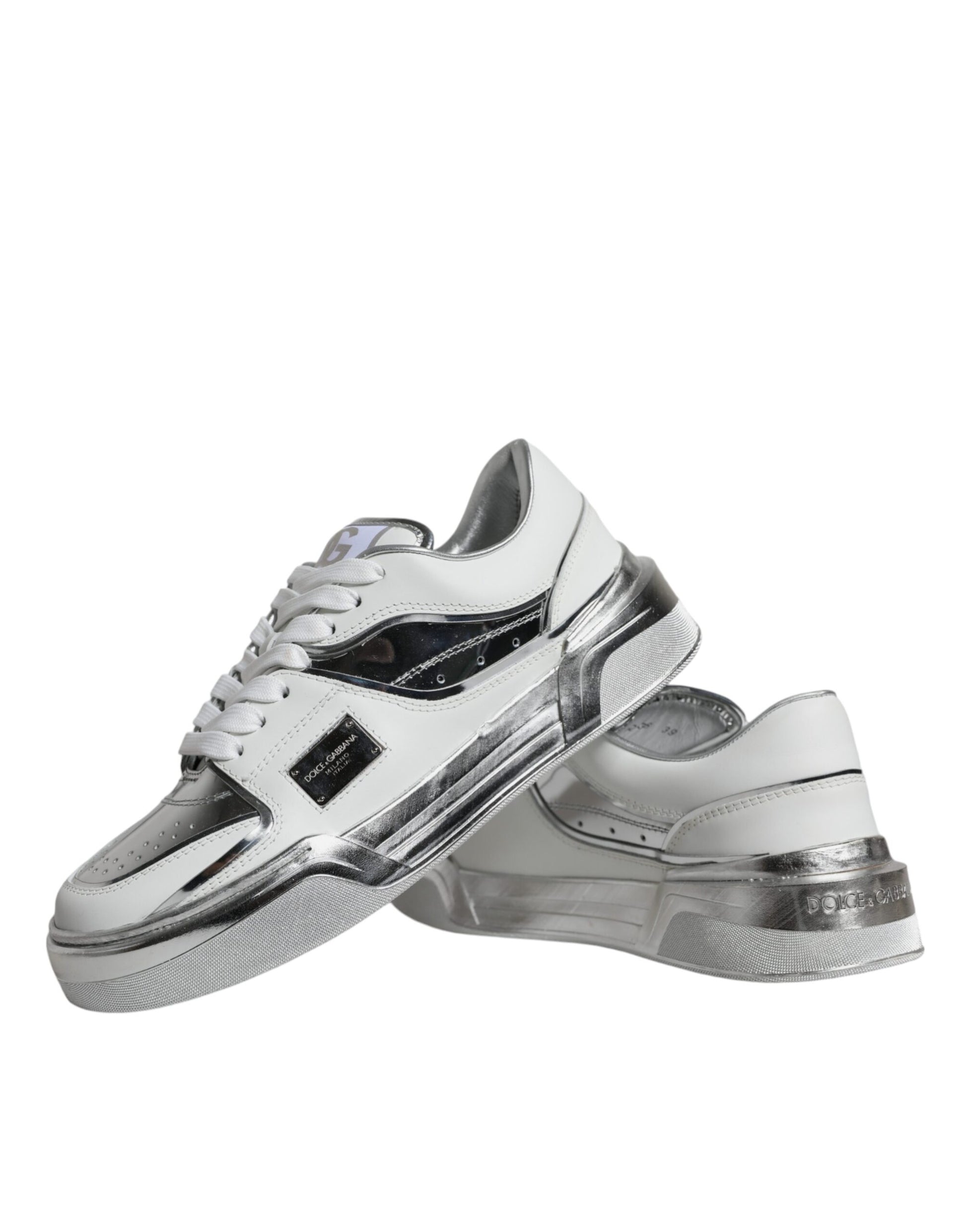 Pair of white silver leather low top sneakers with black laces and logo on side