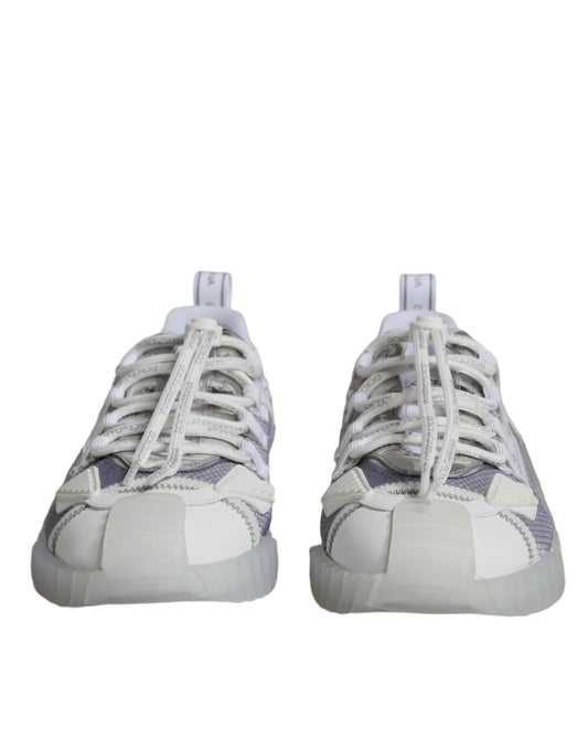 Pair of white and purple sneakers with laces