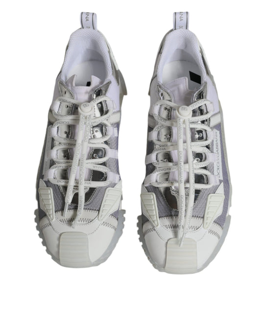 Pair of white and gray athletic shoes with laces