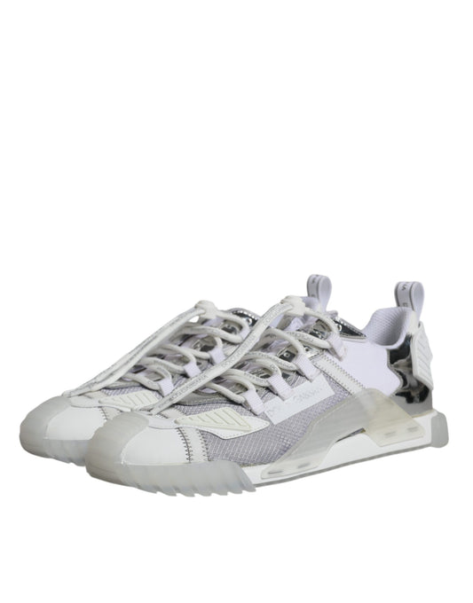 Pair of white and grey sneakers with laces