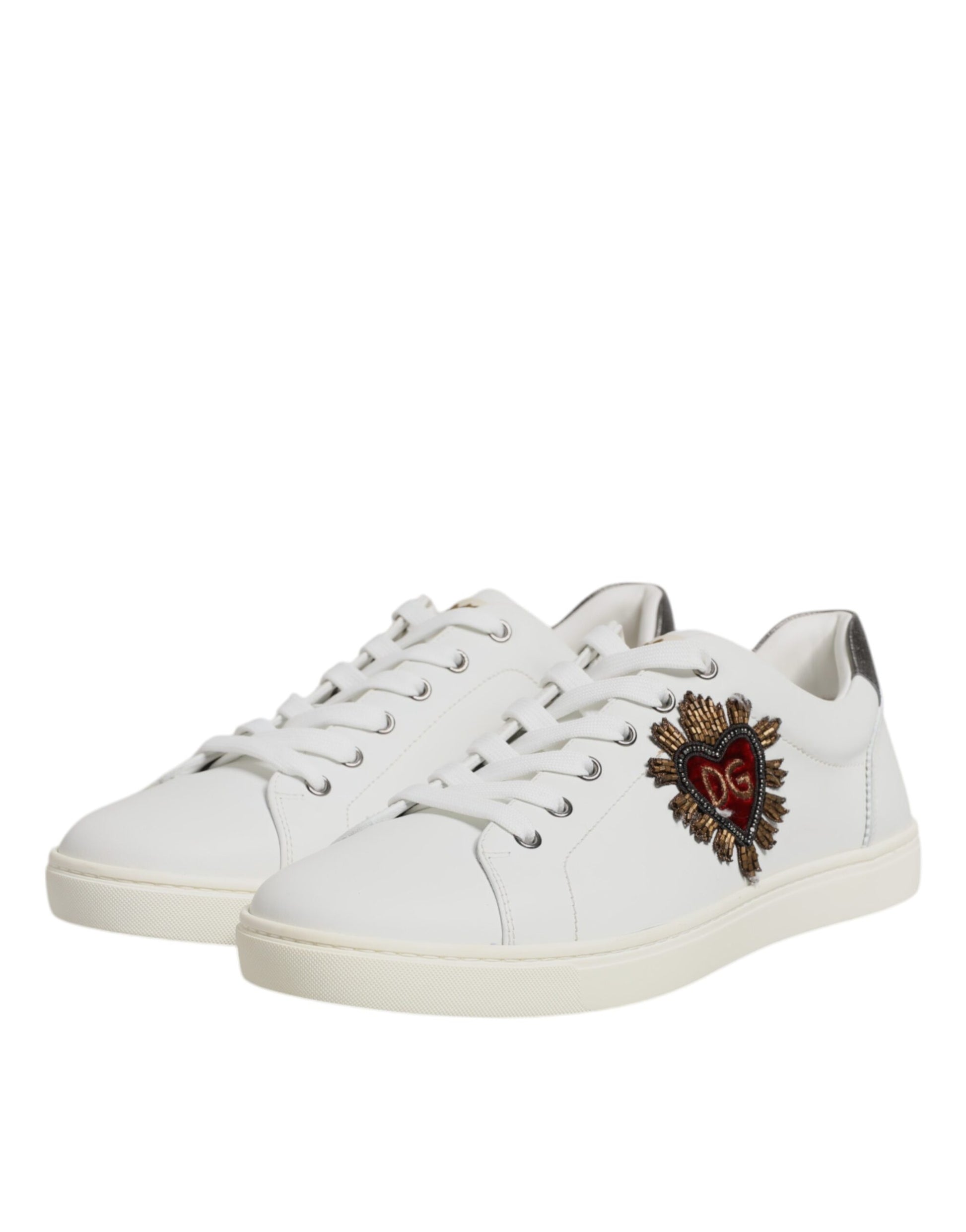 White sneakers with silver accents featuring a red heart design on the side