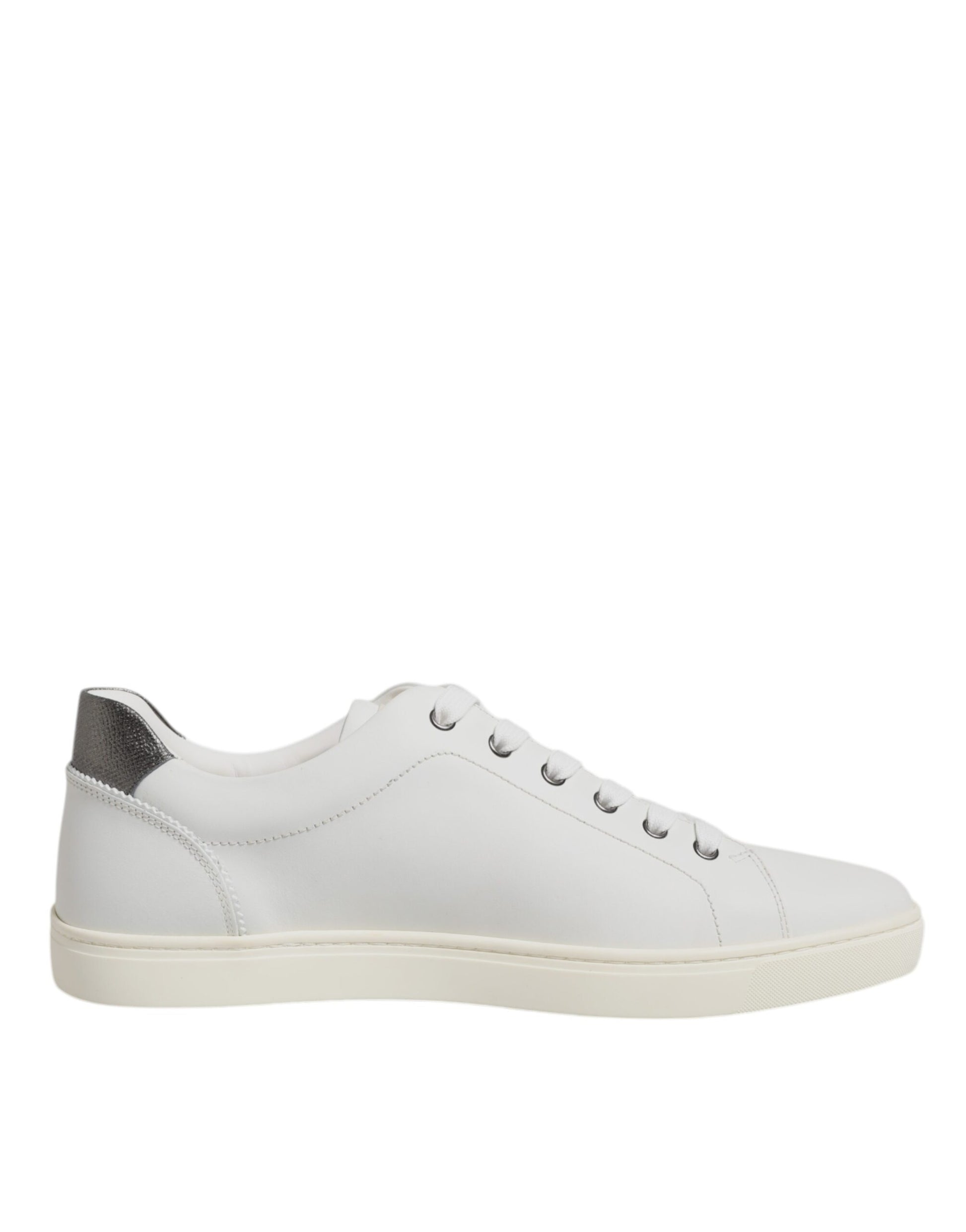 White sneakers with silver accents, featuring a sacred heart design on the side