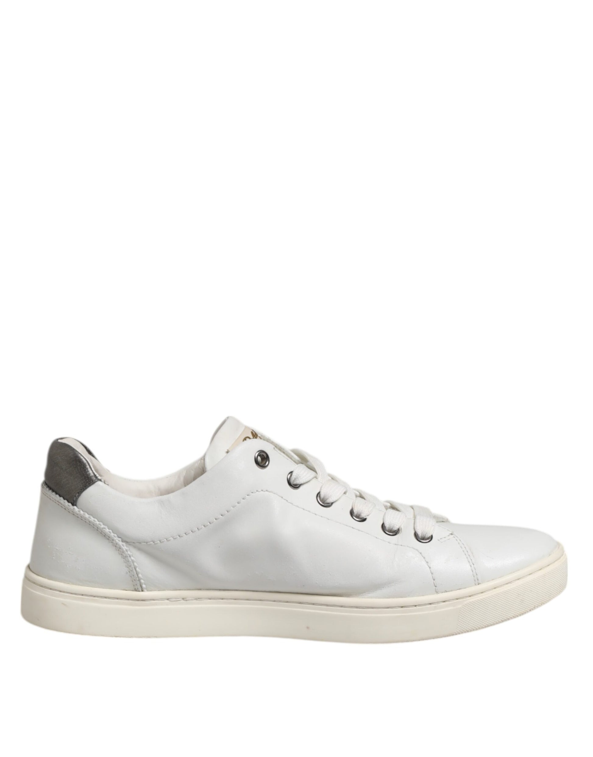 White sneakers with silver accents, featuring a sacred heart design on the side