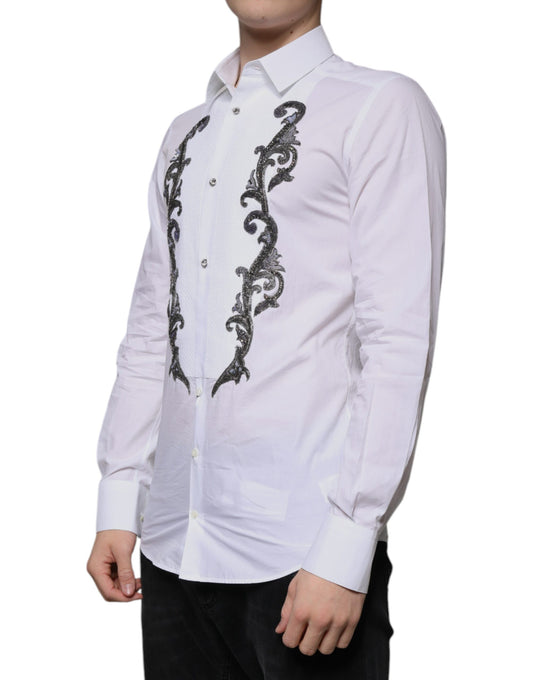 A white slim fit dress shirt with gold embroidery and a baroque design