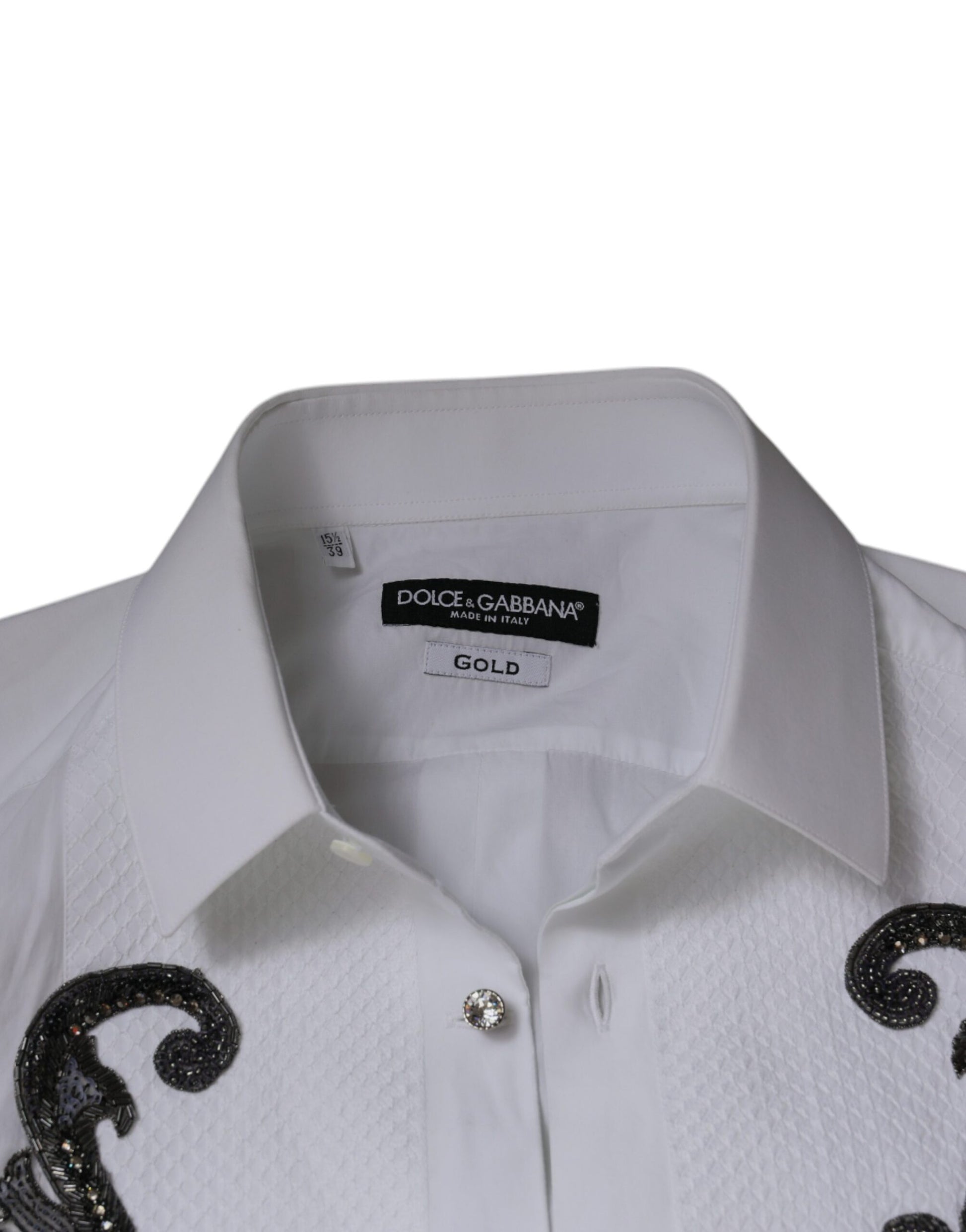 A white slim fit dress shirt with gold embroidery and a baroque design